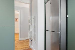 Apartment 39 kitchen fridge hallway